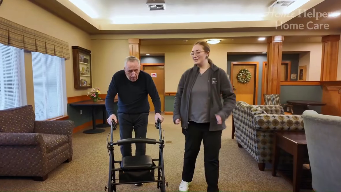 Caregiver with male client at assisted living