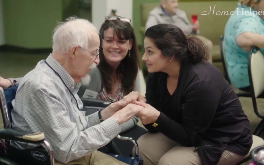 Caregiver with male client at assisted living